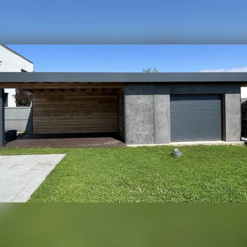 Pool house sur mesure en ossature bois avec bardage effet béton et local de rangement à Schirrhein – BH Solutions
