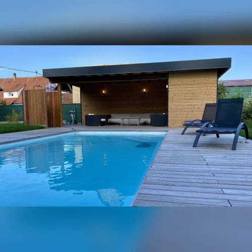 Pool house sur mesure en ossature bois avec salon d’été et piscine à Sessenheim – BH Solutions